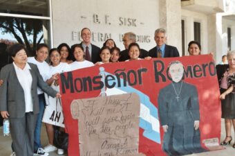 CJA Litigation Director Matt Eisenbrandt and Pro Bono counsel Nico Van Alestyn of Heller Ehrman stand with members of the Salvadoran community outside the Fresno federal courthouse