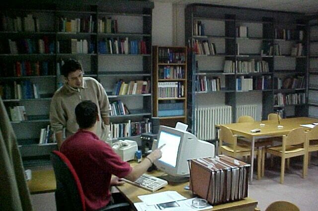 Staff at the Human Rights Centre gathered around a computer