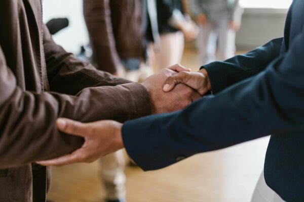 Cropped image of two people shaking hands