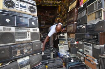 A man in India selling vintage radios